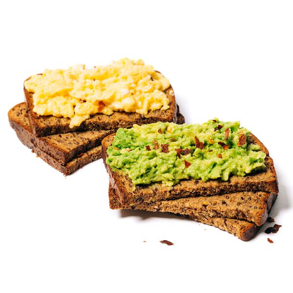 Protein grain and seed bread stacked with eggs and avacados image number null
